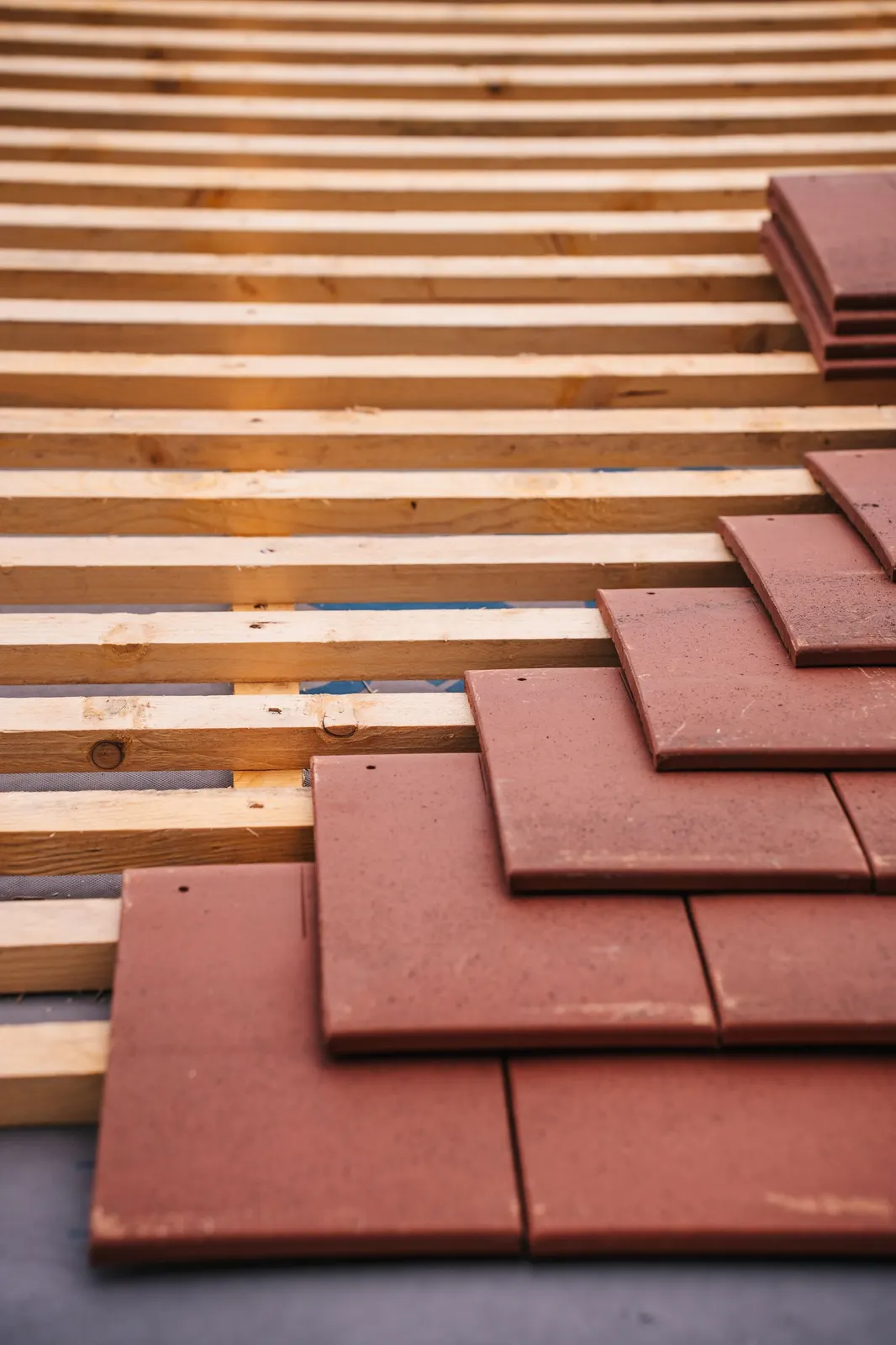New tiles being fitted during a roof replacement in Dudley