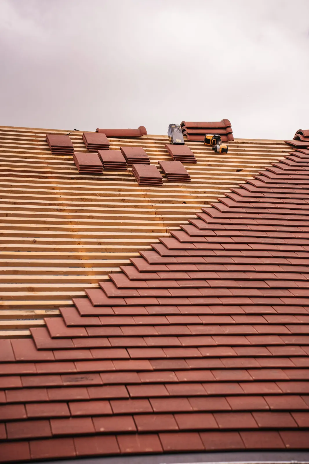 New roof tiles being installed on a house roof in Dudley